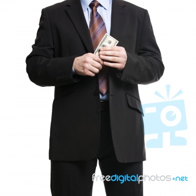 Businessman In Dark Suit With A Bunch Of American Dollars Stock Photo