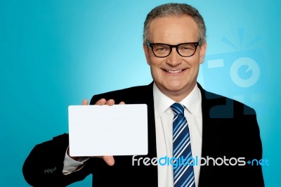 Businessman In Glasses Showing Placard Stock Photo