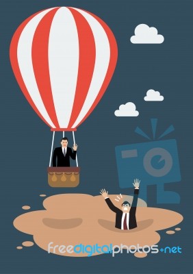 Businessman In Hot Air Balloon Get Away From Quicksand Stock Image