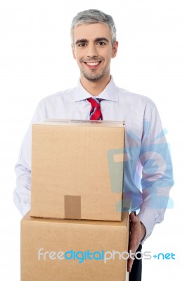 Businessman In  Process Of Relocation Stock Photo