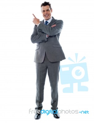 Businessman In Suit Pointing Stock Photo