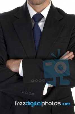 Businessman In Suit With Crossed Hand Stock Photo