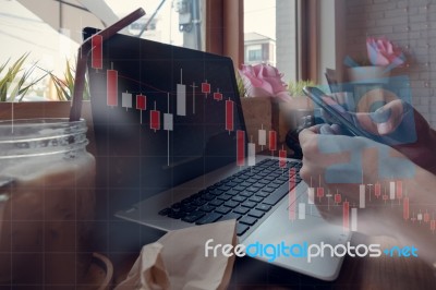 Businessman Is Working With His Computer In Coffee Shop With Sto… Stock Photo