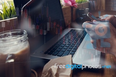 Businessman Is Working With His Computer In Coffee Shop With Sto… Stock Photo