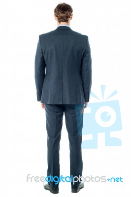 Businessman Looking At The Wall Stock Photo