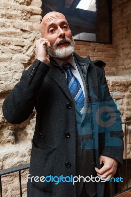 Businessman Looking In Front Of Camera Stock Photo