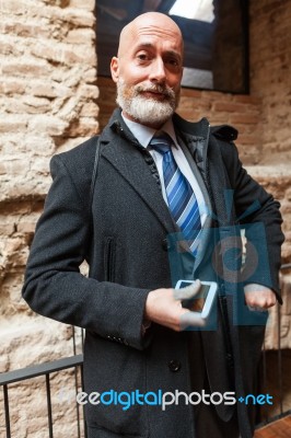 Businessman Looking In Front Of Camera Stock Photo