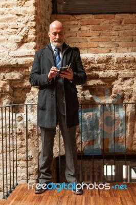 Businessman Looking In Front Of Camera Stock Photo