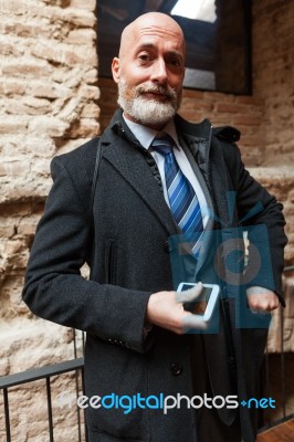 Businessman Looking In Front Of Camera Stock Photo