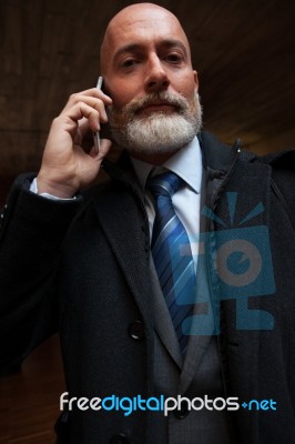 Businessman Looking In Front Of Camera Stock Photo