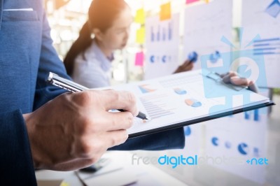 Businessman Making Presentation With His Colleagues And Business… Stock Photo