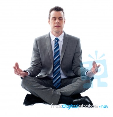 Businessman Meditating Stock Photo