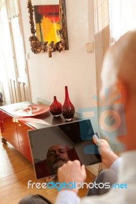 Businessman Middle-aged Working From Home With A Tablet Stock Photo