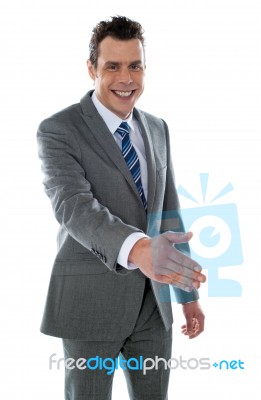 Businessman Offering Handshake Stock Photo