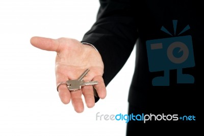 Businessman Offering Keys, Closeup Shot Stock Photo