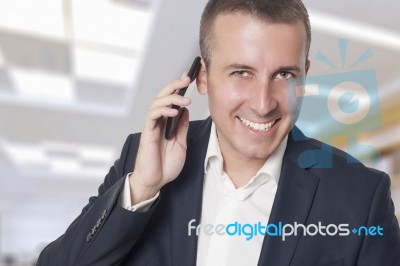 Businessman On Cell Phone Stock Photo