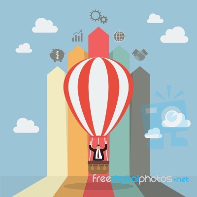 Businessman On Hot Air Balloon With Arrow Bar Chart Stock Image