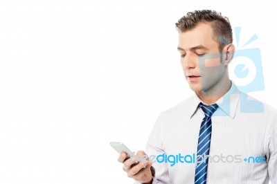 Businessman Operating His Mobile Phone Stock Photo