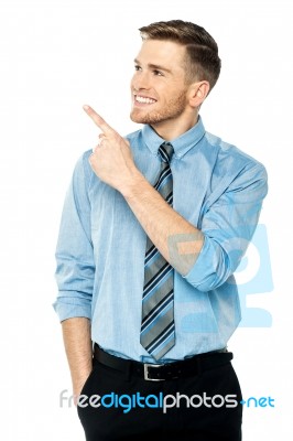 Businessman Pointing At Something Stock Photo