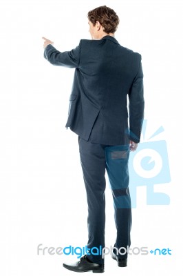 Businessman Pointing At Something Stock Photo