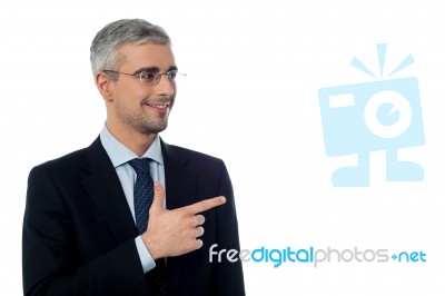 Businessman Pointing At Something Stock Photo