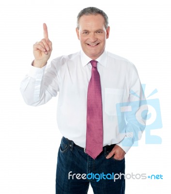 Businessman Pointing Upwards Stock Photo