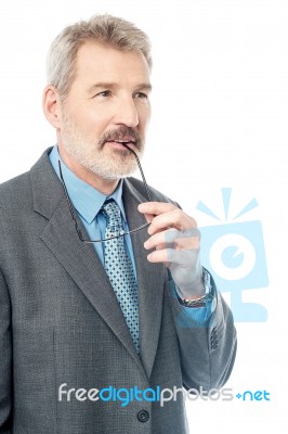 Businessman Pondering About His Goals Stock Photo