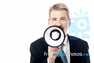 Businessman Posing With Bullhorn Stock Photo