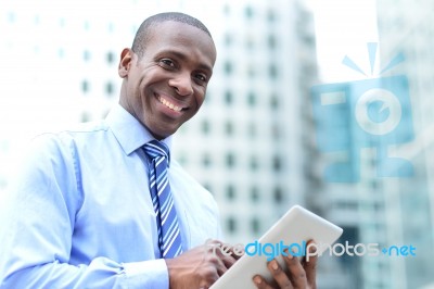 Businessman Posing With Digital Tablet Stock Photo