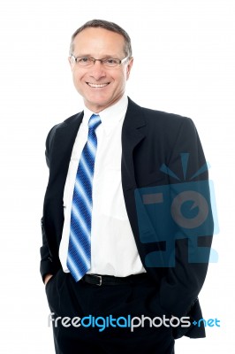 Businessman Posing With Hands In Pockets Stock Photo