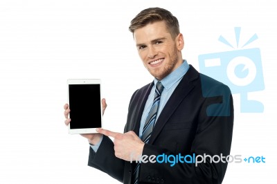 Businessman Presenting New Tablet Device Stock Photo