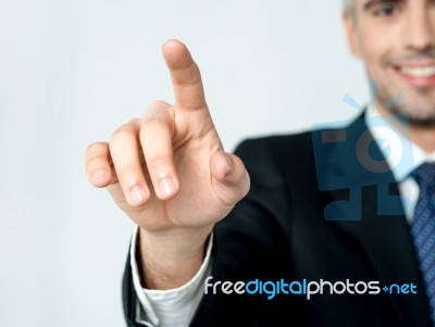 Businessman Pressing On A Virtual Screen Stock Photo