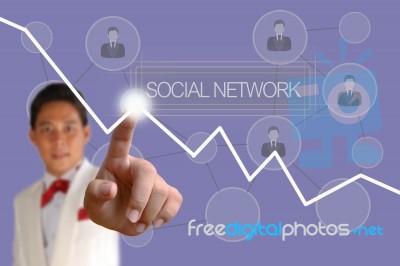 Businessman Pushing Social Network Button Stock Photo