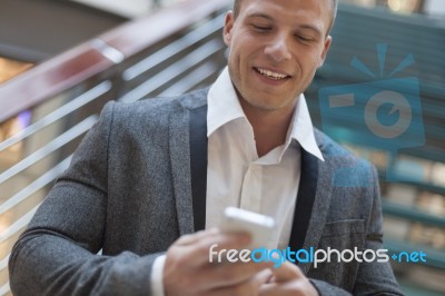 Businessman Read Good News On Smartphone, Business Building Inte… Stock Photo