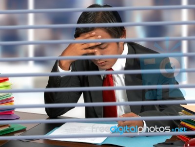 Businessman Reading Documents Stock Photo