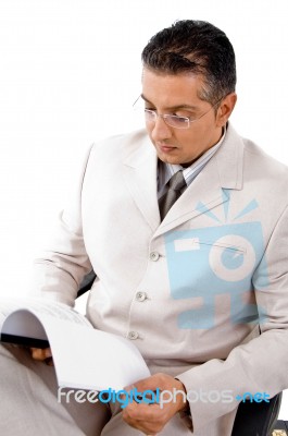 Businessman reading file Stock Photo