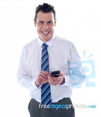 Businessman Reading Text Message Stock Photo