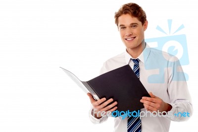 Businessman Reviewing Office Records Stock Photo