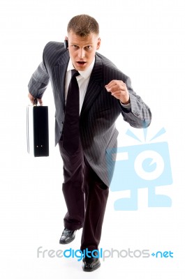 Businessman running with Briefcase Stock Photo