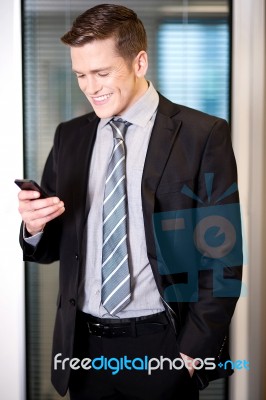 Businessman Sending Text Message Stock Photo