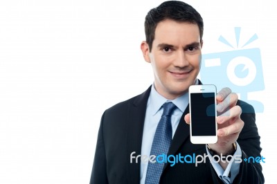 Businessman Showing A Mobile Phone Stock Photo