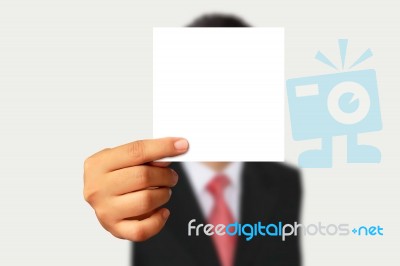 Businessman Showing Blank Paper Stock Photo