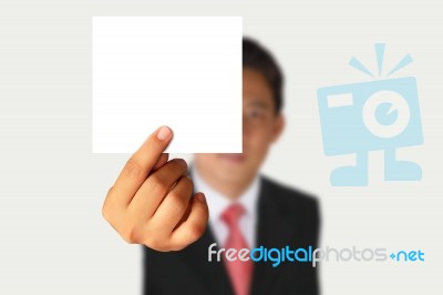 Businessman Showing Blank Paper Stock Photo