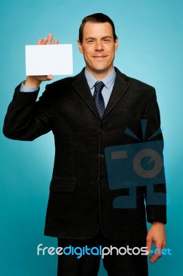 Businessman Showing Business Card Stock Photo