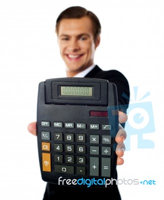 Businessman Showing Calculator Stock Photo