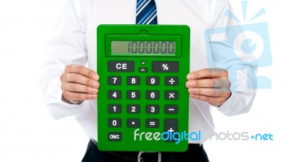 Businessman Showing Calculator Stock Photo