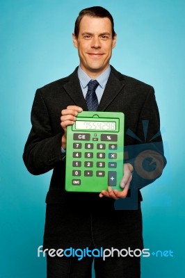 Businessman Showing Calculator Stock Photo