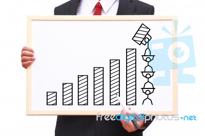 Businessman Showing Idea On White Board Stock Photo