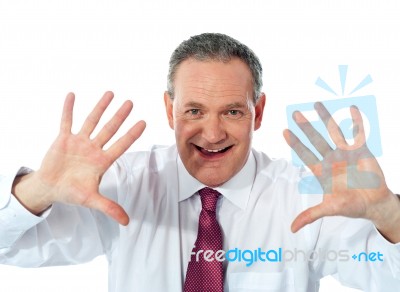 Businessman showing palms Stock Photo