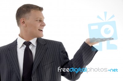 Businessman Showing Something Stock Photo